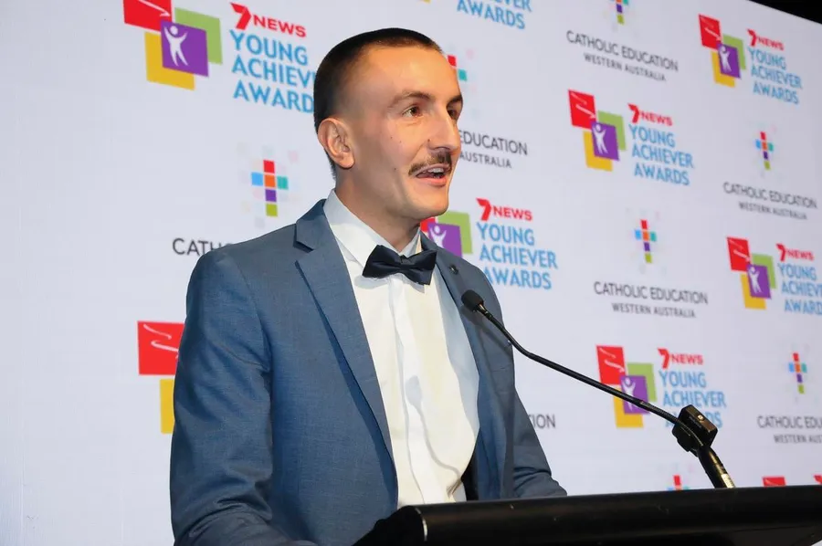 Wil at an awards podium