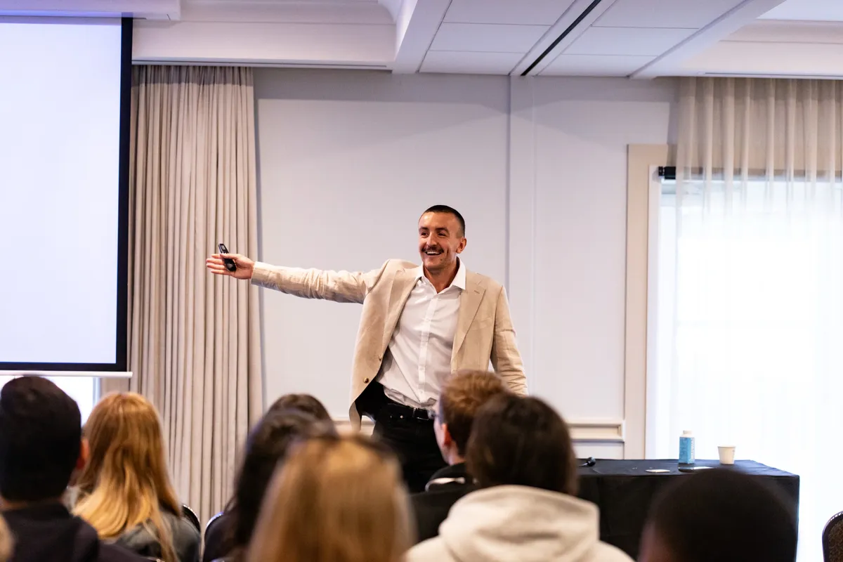 Wil Massara on stage delivering a keynote